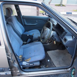 Proton Saga car rental - interior shot of drivers seat