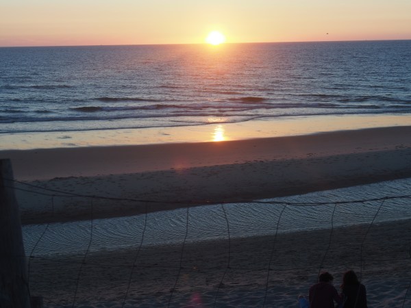The drink. The sunset. The beach
