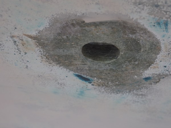 Yes, a large hole in the bottom of the boat.  Was our old, non-functional depth transducer. One more hole in the bottom closed off. Back to the lead line.