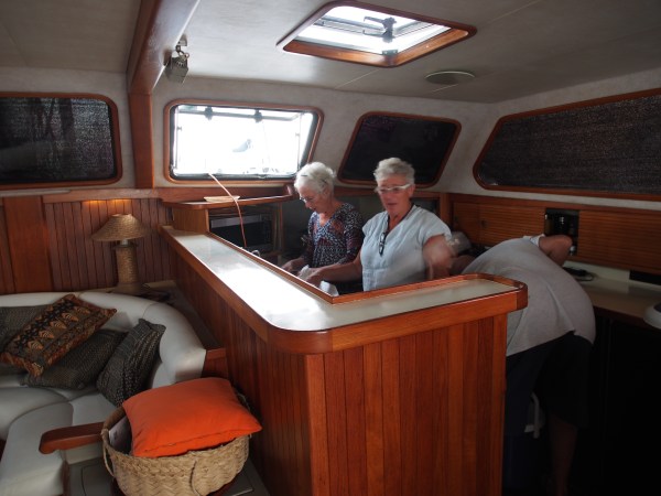 Lorraine and Connie in the galley of Katani getting the appies ready