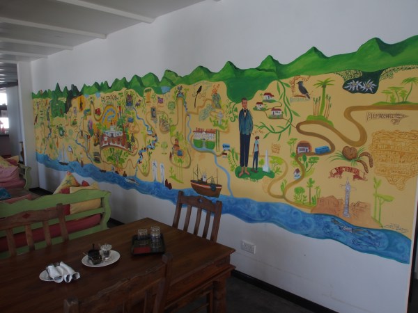 The lounge dining area has a great mural map of Mahe