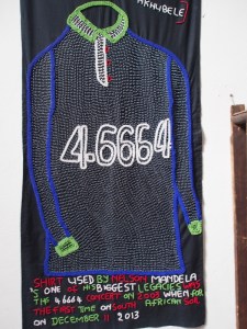 I believe the symbolism here relates to the prisoner number given to Nelson Mandela. Modern beaded jacket